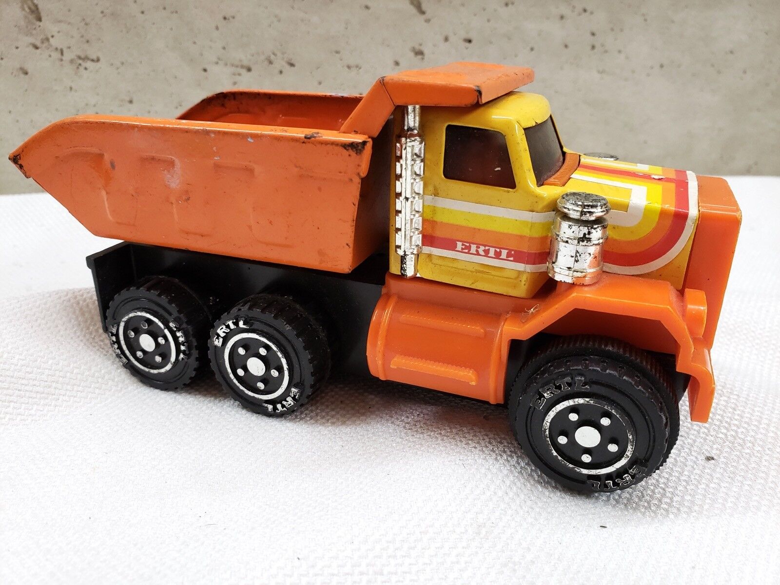 Ertl Orange Pressed Metal and Plastic Dump Truck Vintage 1980’s