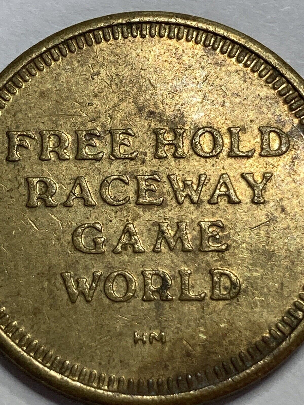 OLD FREEHOLD RACEWAY - GAME WORLD VIDEO GAME ARCADE AMUSEMENT TOKEN - LOOK
