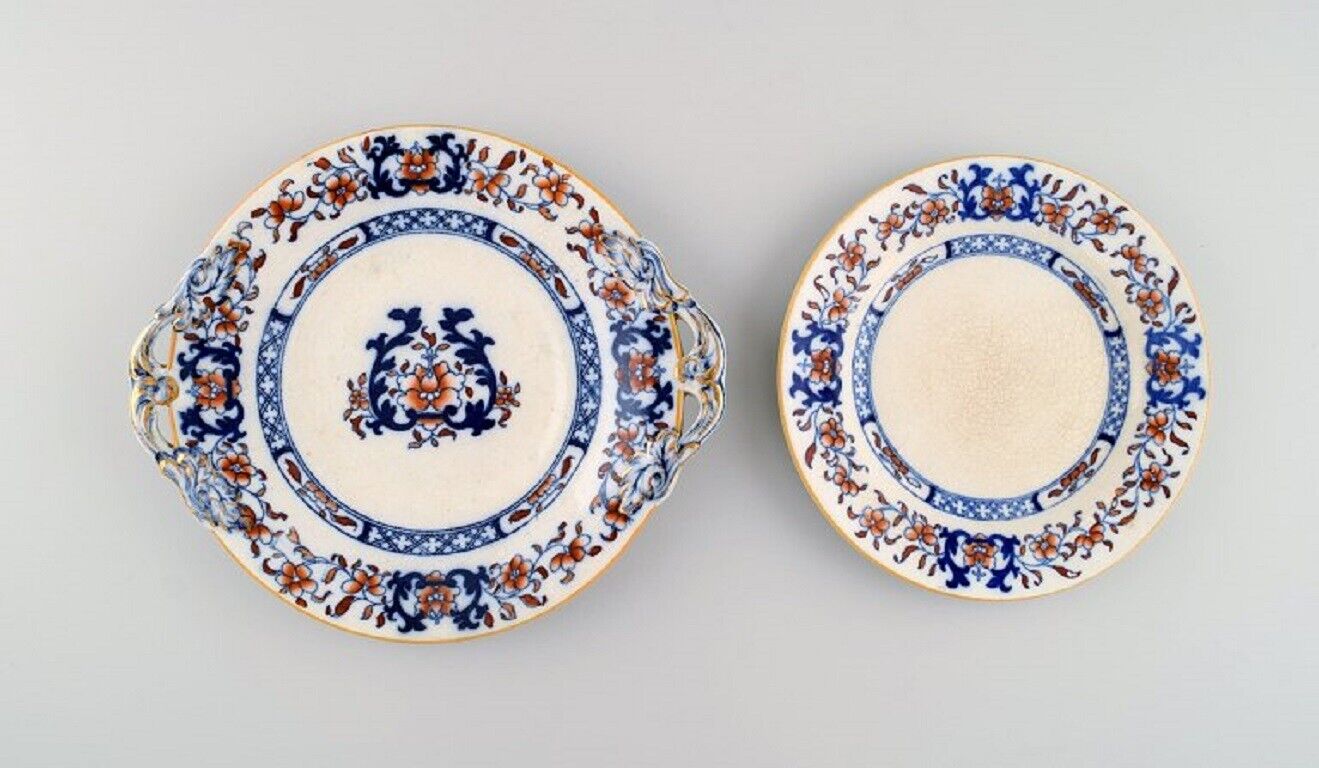 Mintons, England. Two antique plates in hand-painted faience. Chinese style.
