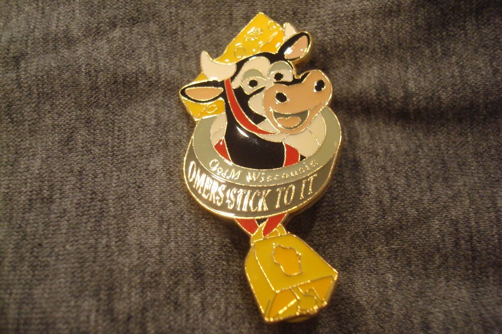 2009 Wisconsin Cow w/ Bell and Slogan Omers Stick To It Odyssey of the Mind Pin