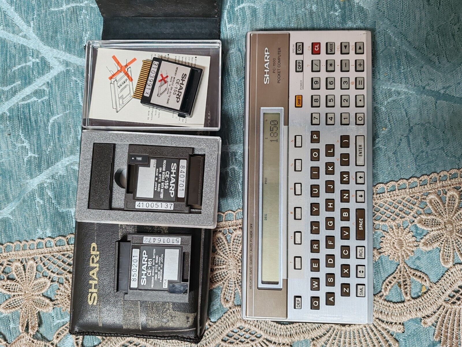 Vintage SHARP PC1500 calculator with CE-155, CE-159, CE-161 in good condition