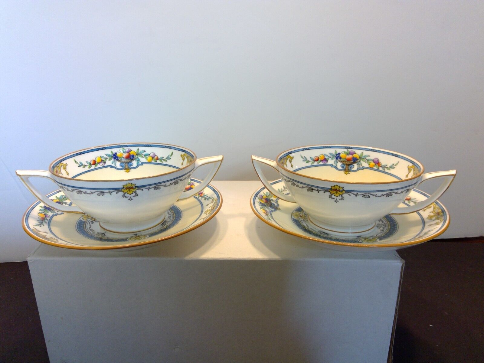 Pair of Antique Minton China Enameled Fruit & Leaves Cream Soup & Saucer Sets
