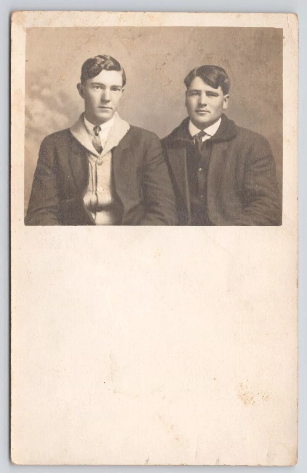 RPPC Two Young Men In Studio In Overcoats c1910 Postcard