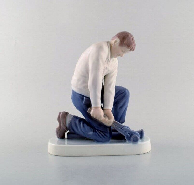 Bing & Grondahl porcelain figurine. Plumber. Model Number: 2432. 
