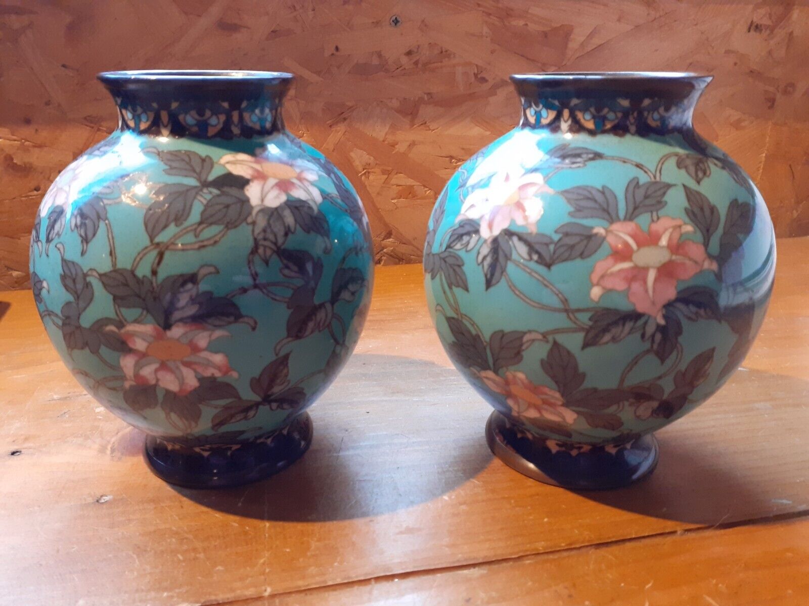 Pair of bulbous oriental cloisonne enamel vases with lovely floral decoration