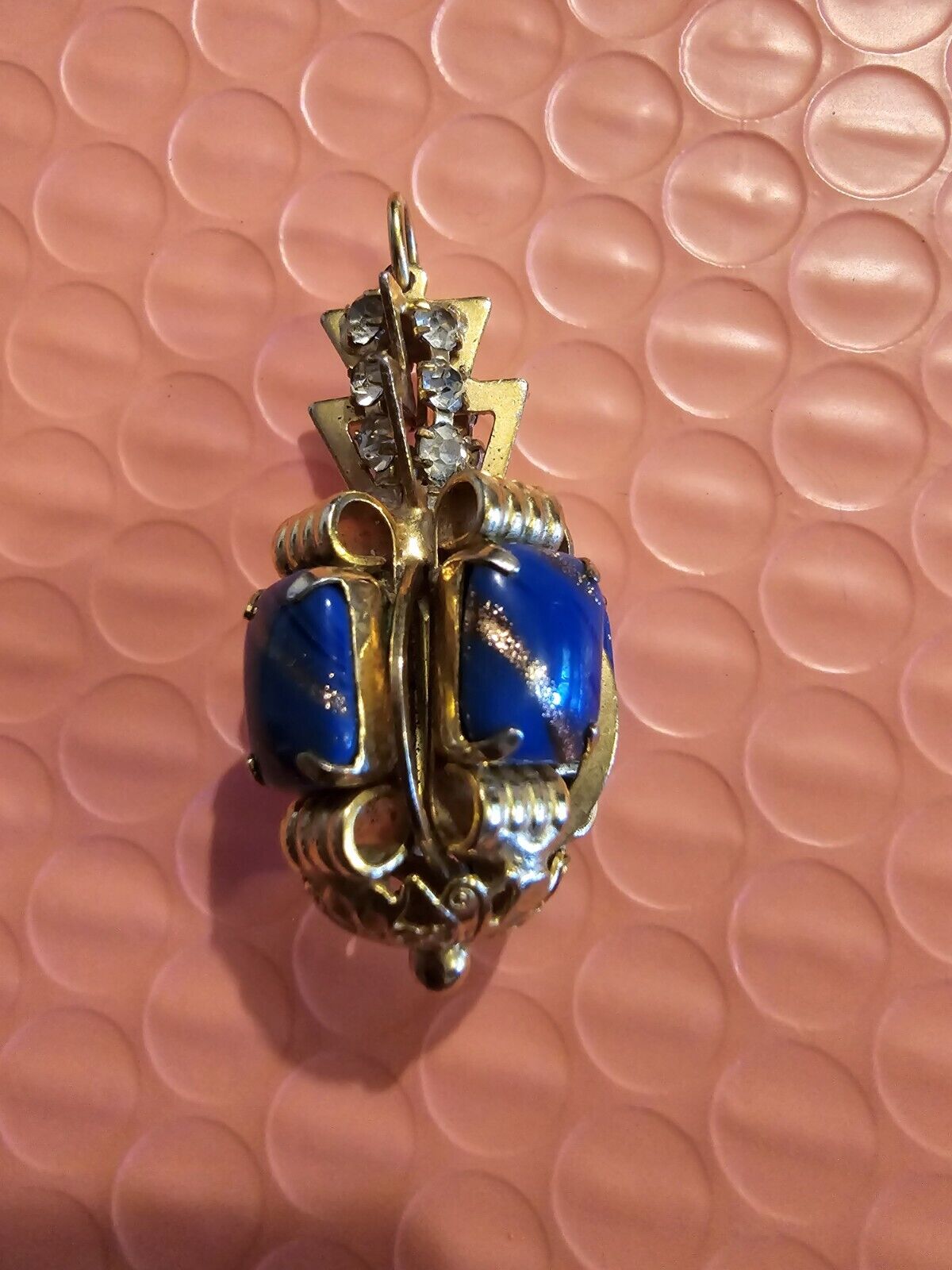 Unique royal looking blue stone and diamond pendant
