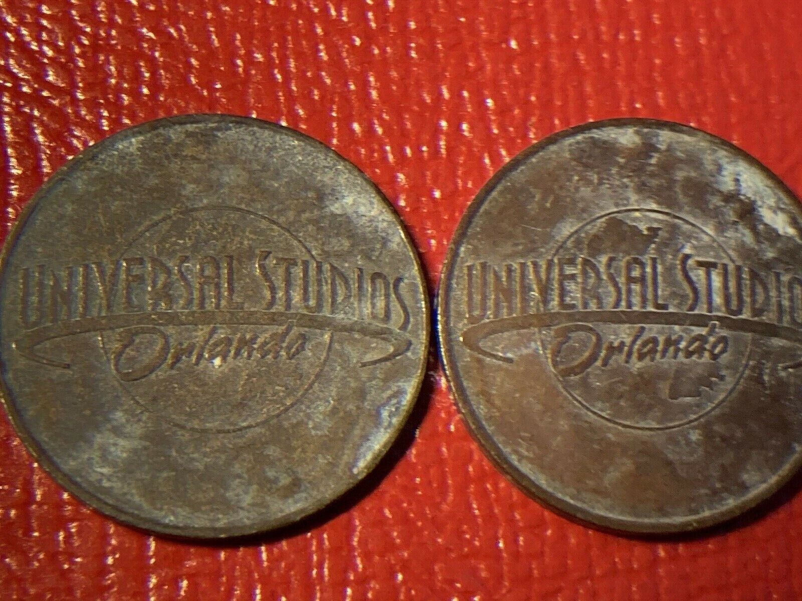 2 VERY VINTAGE Universal Studios, Orlando Game Tokens (obsolete, retired) 