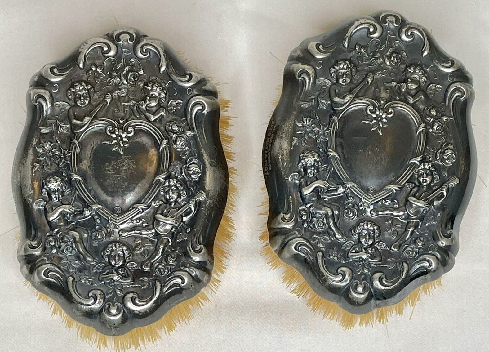 Antique 1907 Victor Silver Co. Pair Brushes Plated Repousse Cherubs with Heart