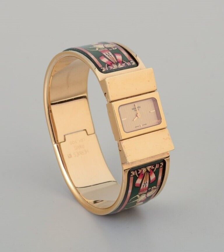 Hermes, ladies\' wristwatch. Made of gilded metal and enamel work.