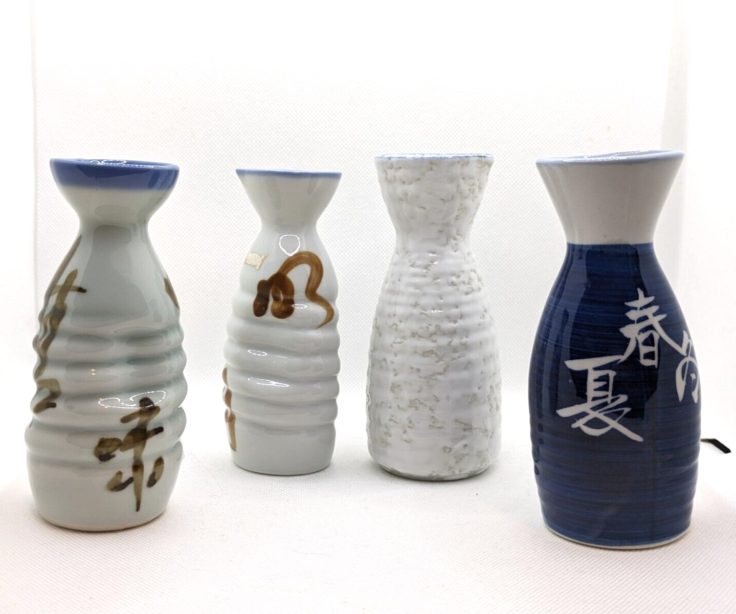 Set of 4 Ceramic Sake Bottles Blue and White, all different coordinating designs