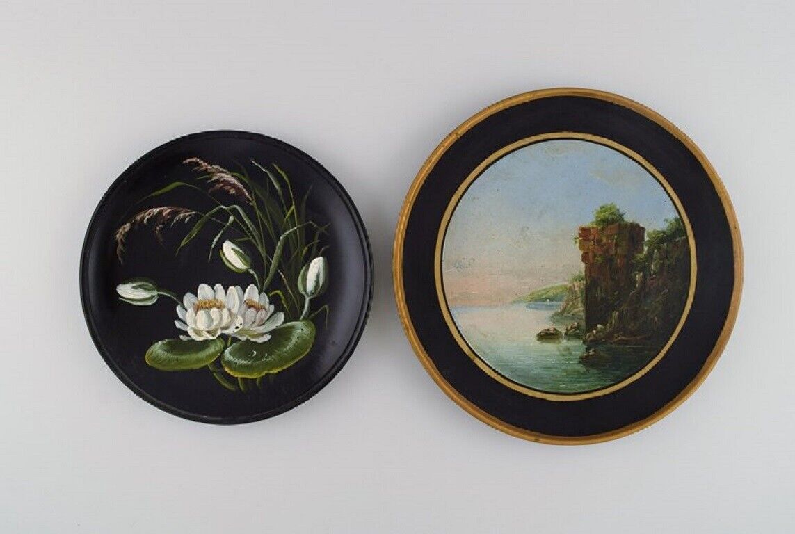 Two antique Hjorth decorative plates in hand-painted teracotta. Late 19th C.