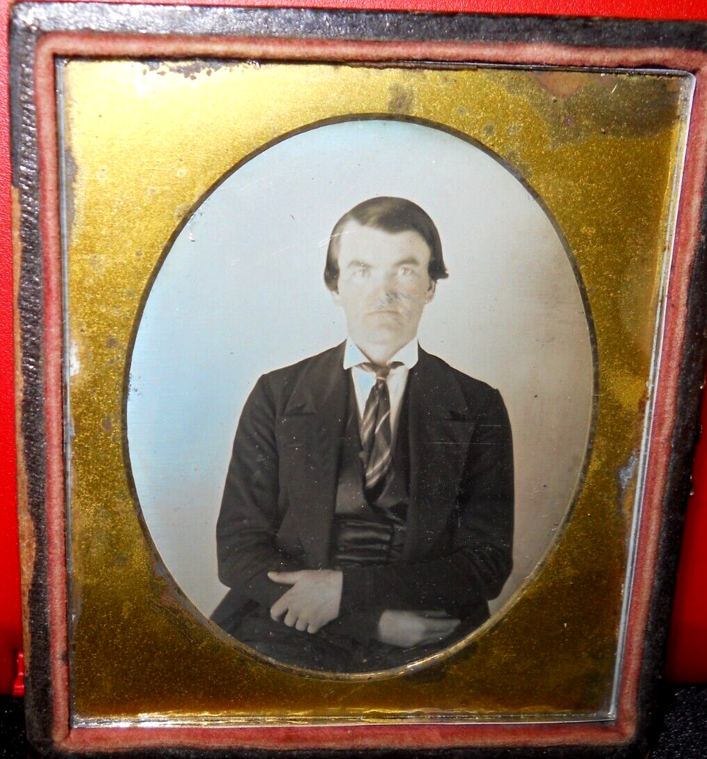 1/6th size Scovills Daguerreotype of young man in half case