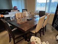 Dinning room table that seats 8 (leave extension) and includes 6 chairs picture