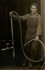 Long day at the fuel pump Tired Man wrapped finger 1915 era RPPC Postcard SC1 picture
