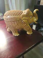 Benzara Hand Carved Wooden Elephant Statue With Cutout Work, Beige India Art picture