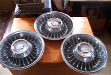 OE vintage trio of 1961 Cadillac wheelcovers, unrestored, not too shabby for age picture