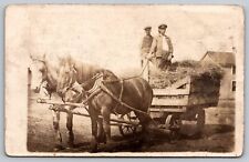 RPPC 2 Farmers hauling Hay w/2 Draft Horses in Rustic Wagon c1904-1918 AZO A13 picture
