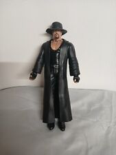 WWE Wrestling Icon The Undertaker With His Signature Trench Coat And Black Hat picture