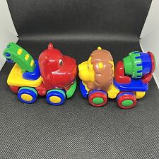 Set of Two Fun Colorful Jackpot Toys Push and Go Vehicles One Lion One Hippo picture