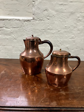 Two antique copper jugs with handle picture