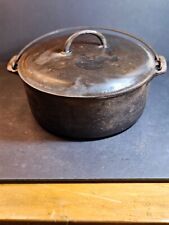 Griswold No. 6 covered pot.cast iron wire handle marked on bottom of pot/and lid picture