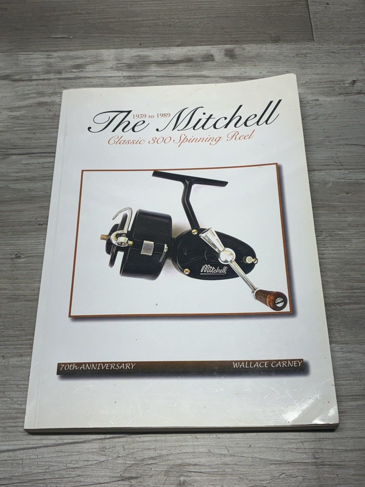 THE MITCHELL CLASSIC 300 SPINNING REEL 70TH ANNIVERSARY BY WALLACE CARNEY Signed