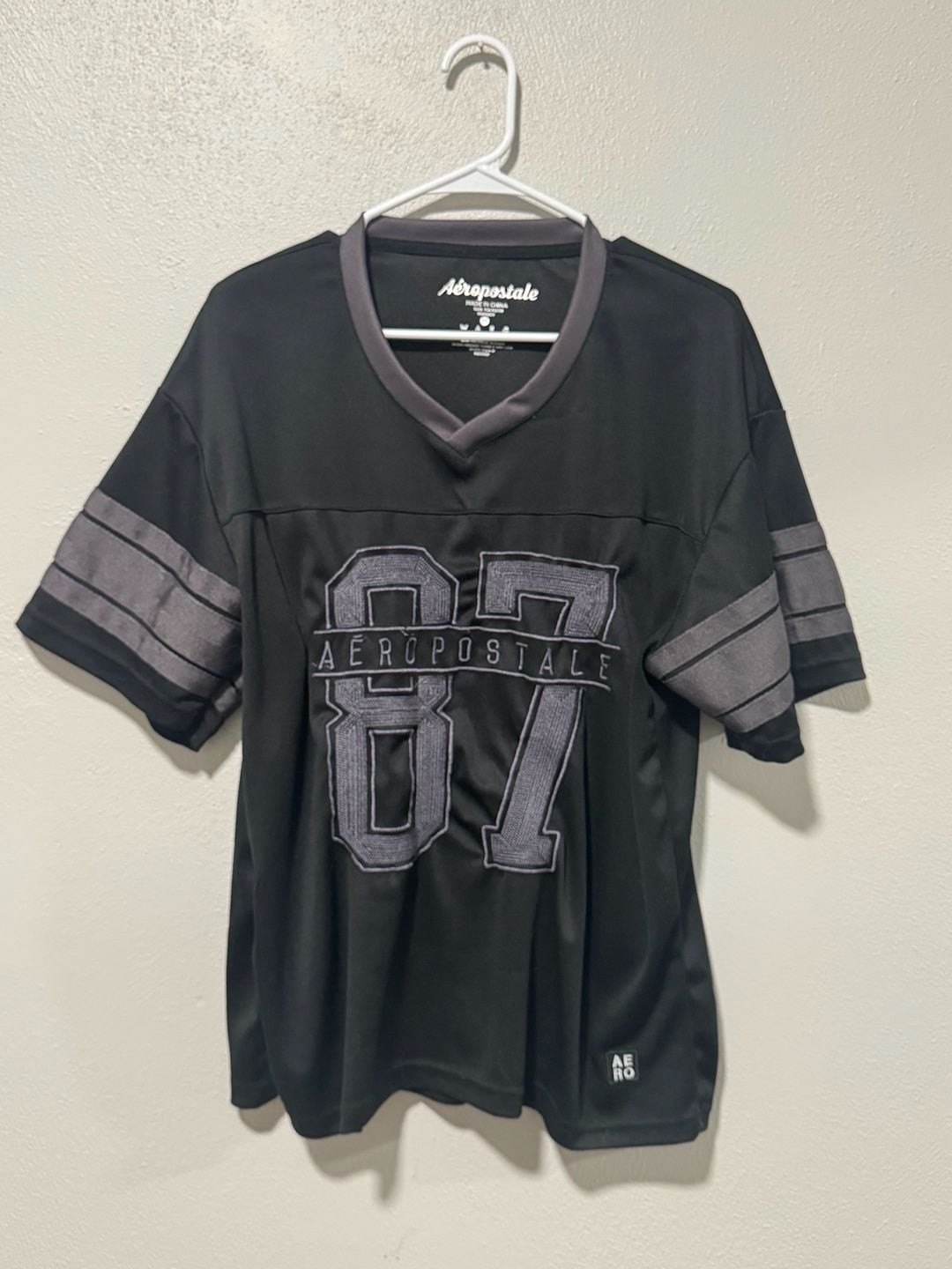 Aeropostale 87 Football Jersey Size M Black V-Neck Mesh