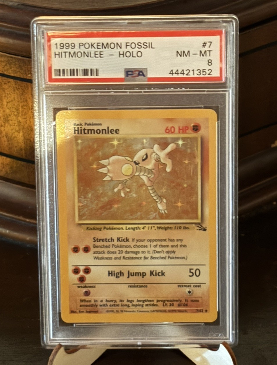 1999 POKEMON FOSSIL #7 HITMONLEE-HOLO PSA 8 NM-MT perfect swirl spec on finger 1999 POKEMON FOSSIL #7 HITMONLEE-HOLO PSA 8 NM-MT perfect swirl spec on finger