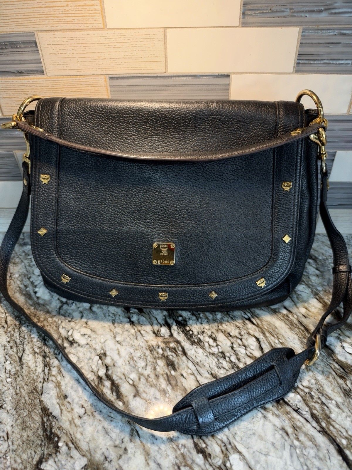 MCM Black Leather Messenger Bag W/Gold Color Accents EUC MCM Black Leather Messenger Bag W/Gold Color Accents EUC