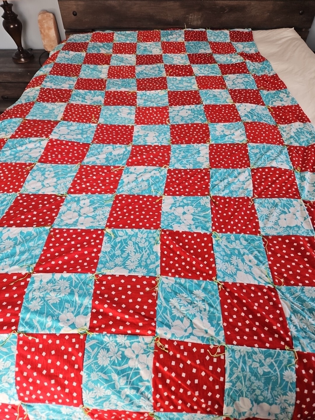 Vintage fifty two by ninety red and blue patchwork knotted quilt Vintage fifty two by ninety red and blue patchwork knotted quilt