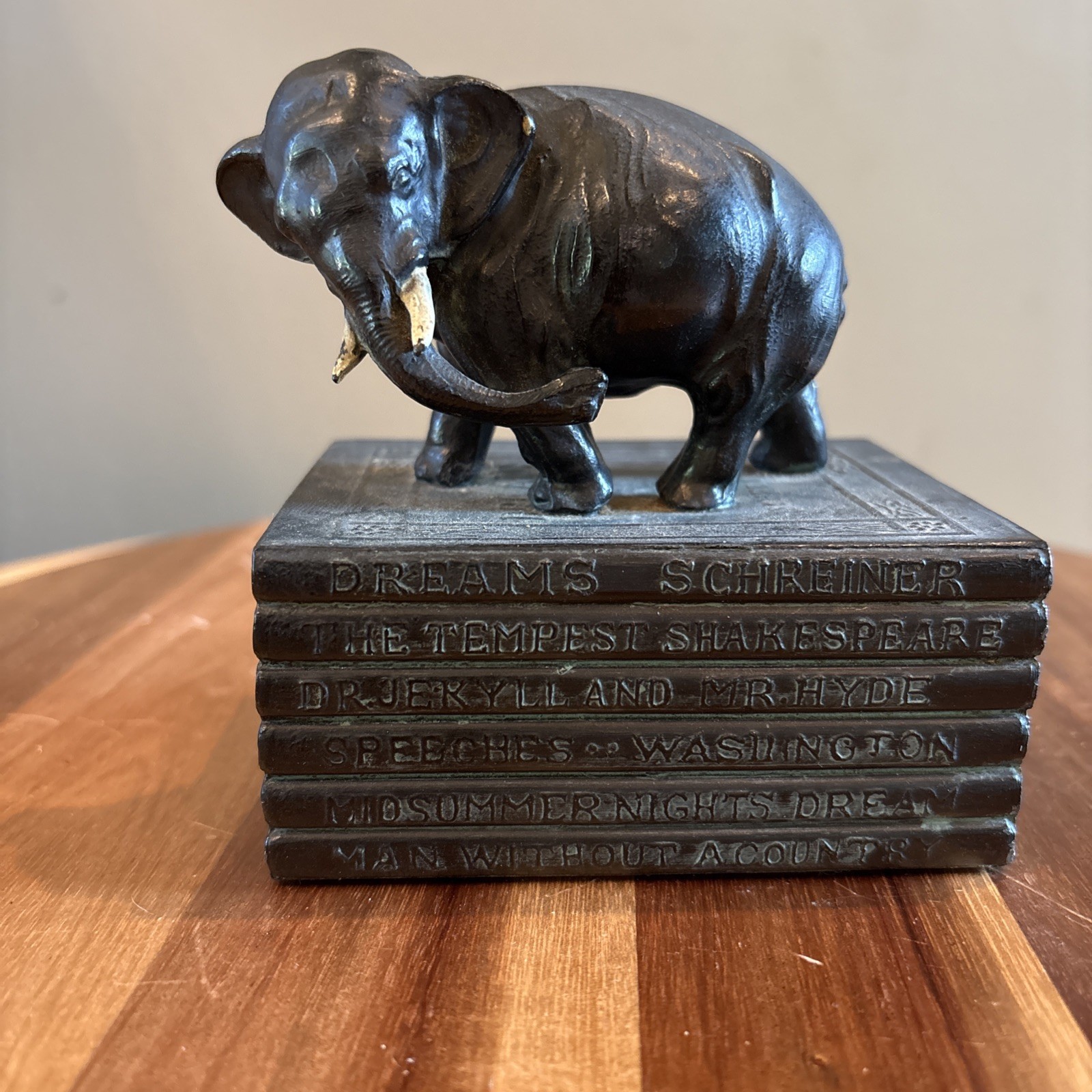vintage Robson cast iron elephant on stack of books bookend.