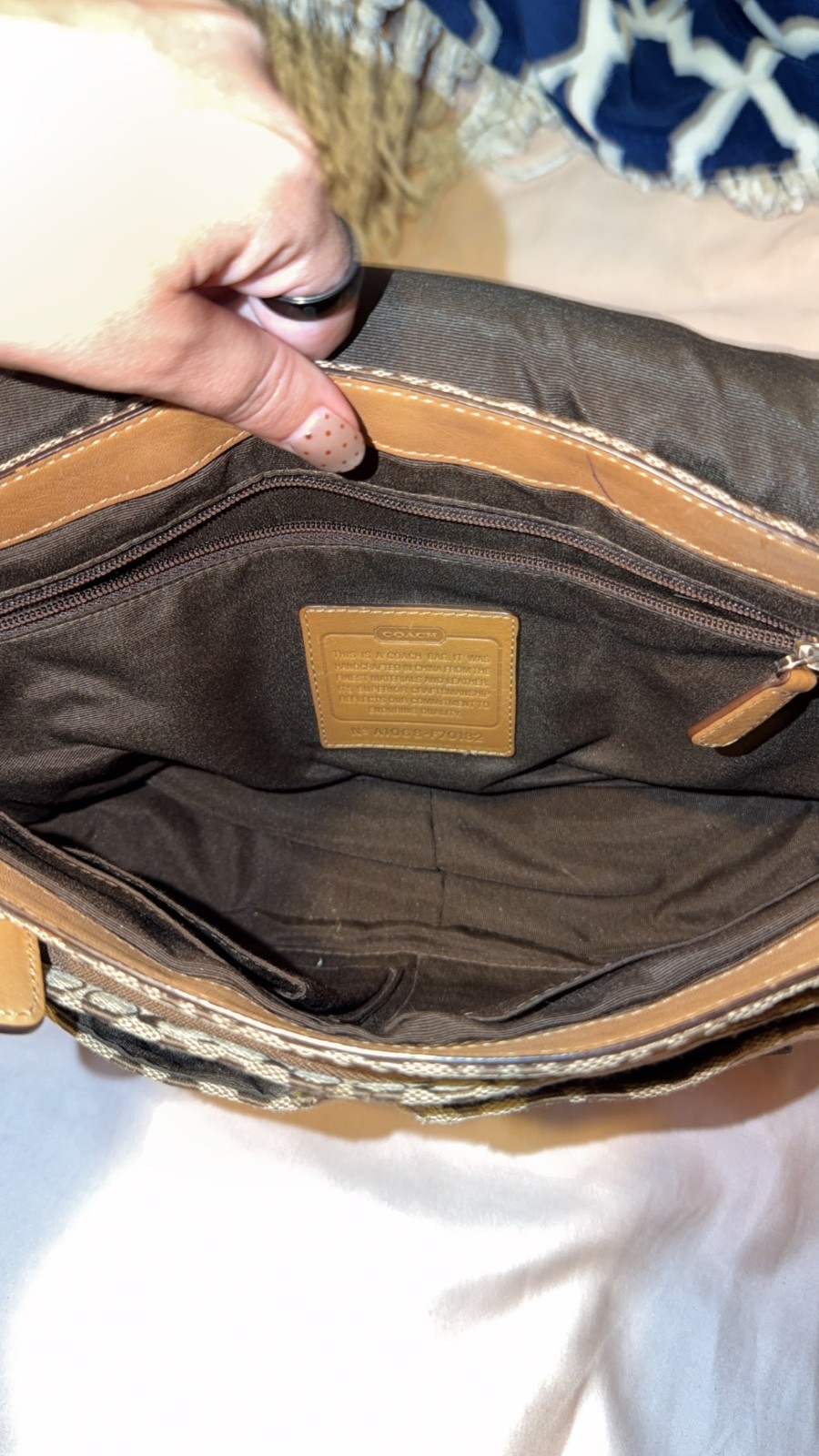 vintage coach purse/satchel has one spot rest is perfect. Brown tan and white.