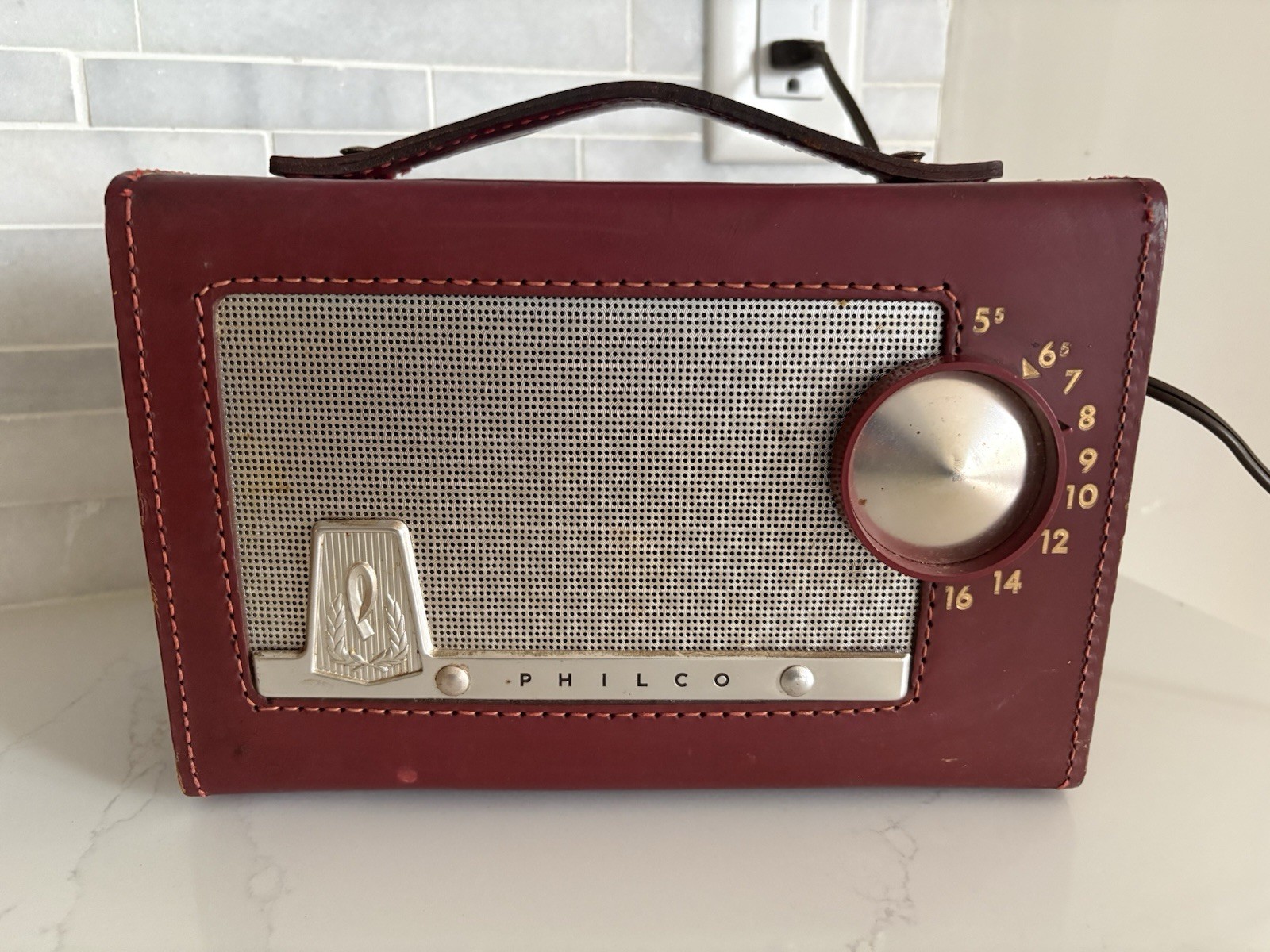 1956 Philco E-675-124 ‘The Sportster’ tube-type AM Radio, Red leather carry case