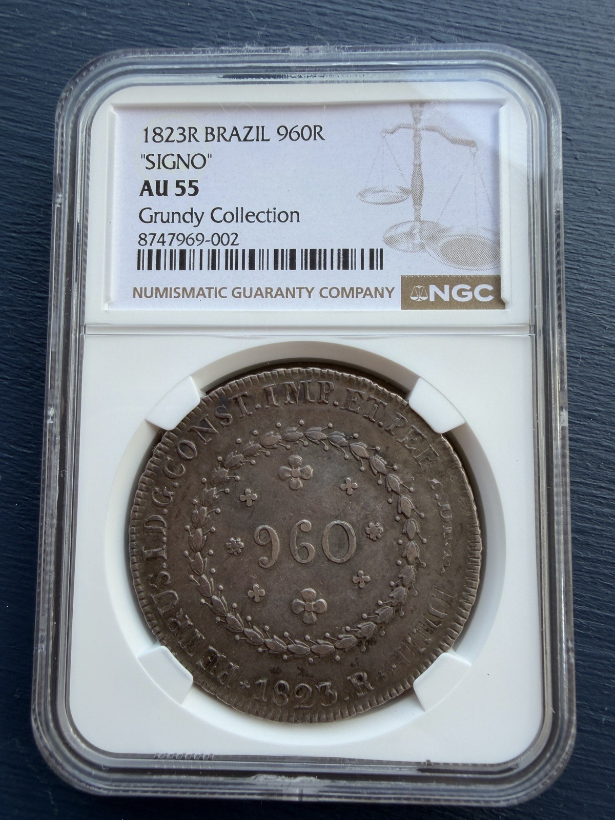 Brasil 960 Réis 1823R “SIGNO” NGC AU55 – Moneda de Plata – Brazil Brasil 960 Réis 1823R “SIGNO” NGC AU55 – Moneda de Plata – Brazil