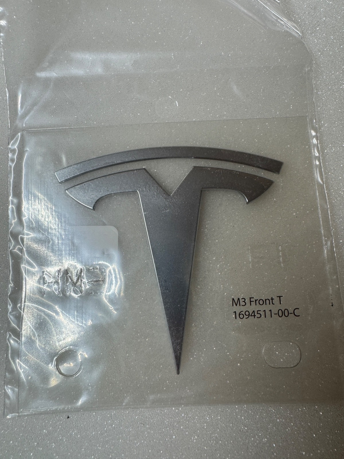 NEW OEM 24-26 Genuine Tesla model 3 Front T-Badge chrome 1694511-00-C