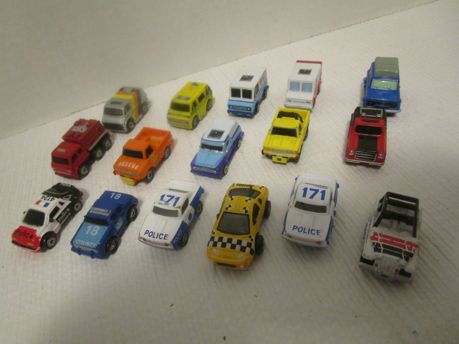 Micro Machines Lot of  16 Vehicles Police Cars, Taxi, Vans, Jeep, Trucks & SUVs