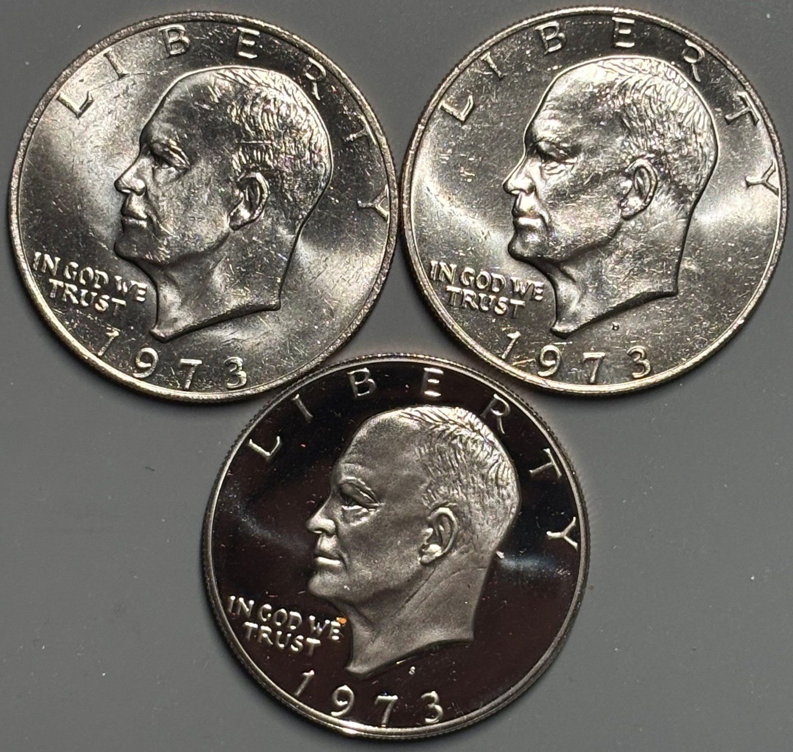1973 P D S - Clad Proof and P & D Uncirculated Eisenhower Ike Dollar 3 Coin S13 1973 P D S - Clad Proof and P & D Uncirculated Eisenhower Ike Dollar 3 Coin S13