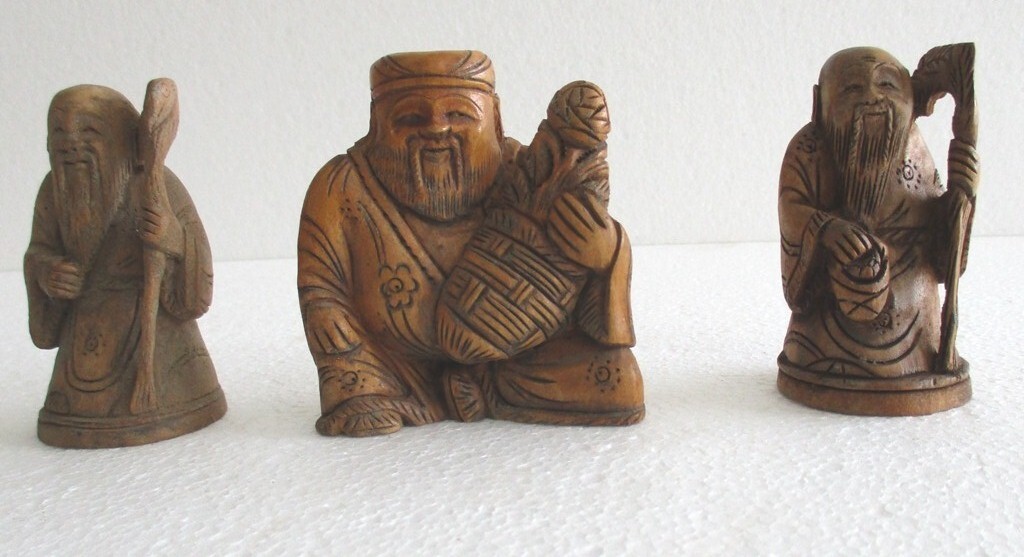 VINTAGE WOODEN CHINESE FIGURES SET OF THREE .