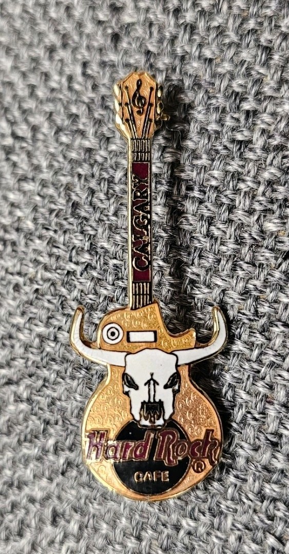 Hard Rock Cafe Calgary Skull Guitar pin.  Mint Condition 