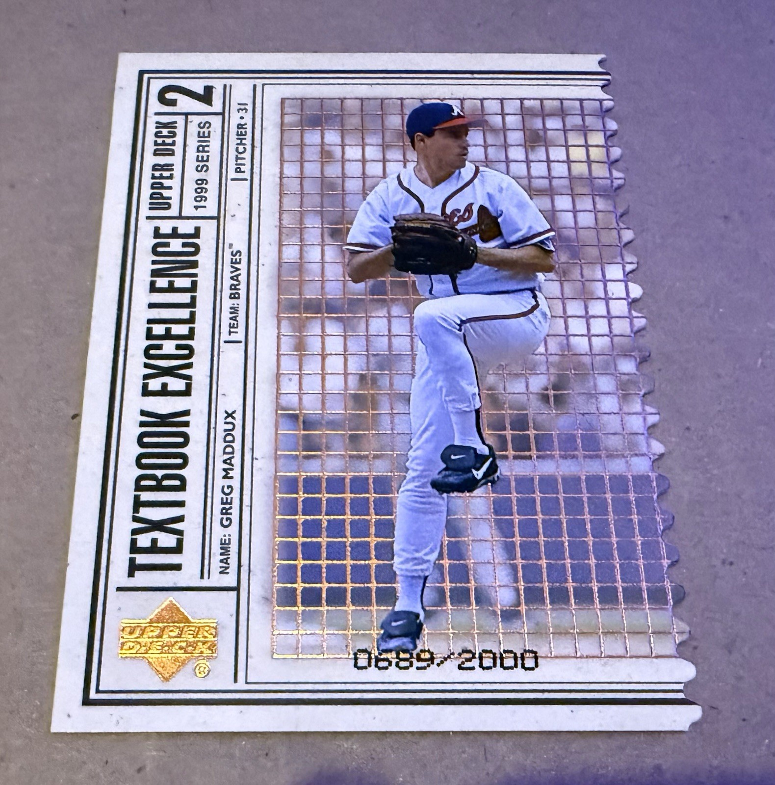 1999 Upper Deck - Textbook Excellence Greg Maddux #T2 Double /2000 Diecut 1999 Upper Deck - Textbook Excellence Greg Maddux #T2 Double /2000 Diecut