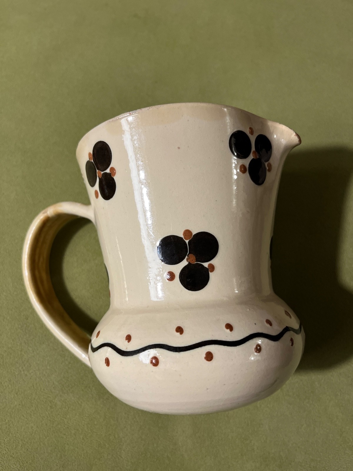 1930\'s small white pitcher with black and red flowers by potter Herman Kahler 1930\'s small white pitcher with black and red flowers by potter Herman Kahler