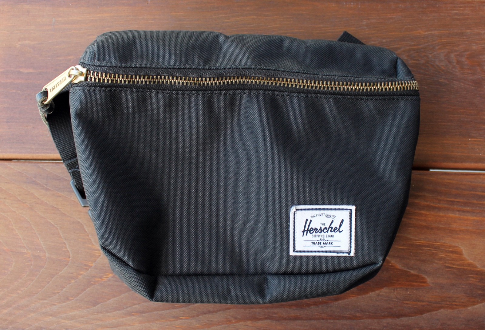 Black Herschel fanny pack/belt bag with red stripe lining