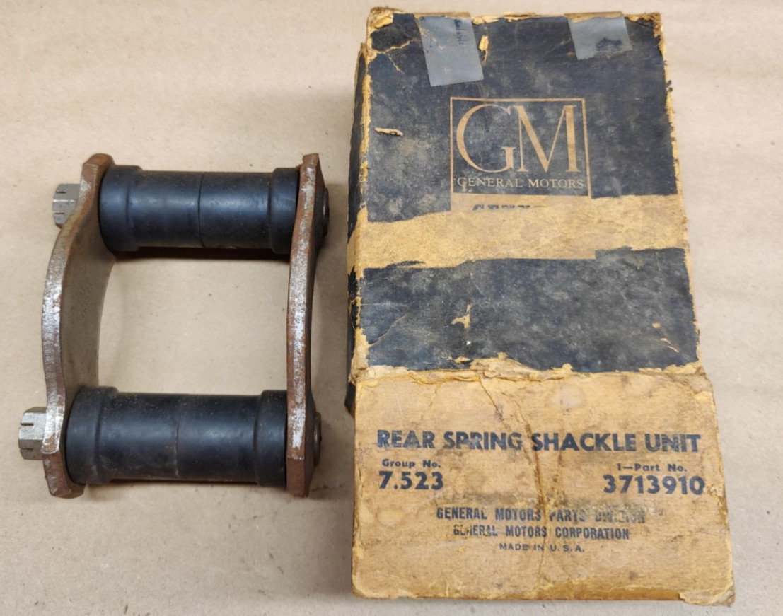 NOS OEM 1955 Chevy Passenger Dual Bushing Rear Spring Shackle Unit GM 3713910 NOS OEM 1955 Chevy Passenger Dual Bushing Rear Spring Shackle Unit GM 3713910