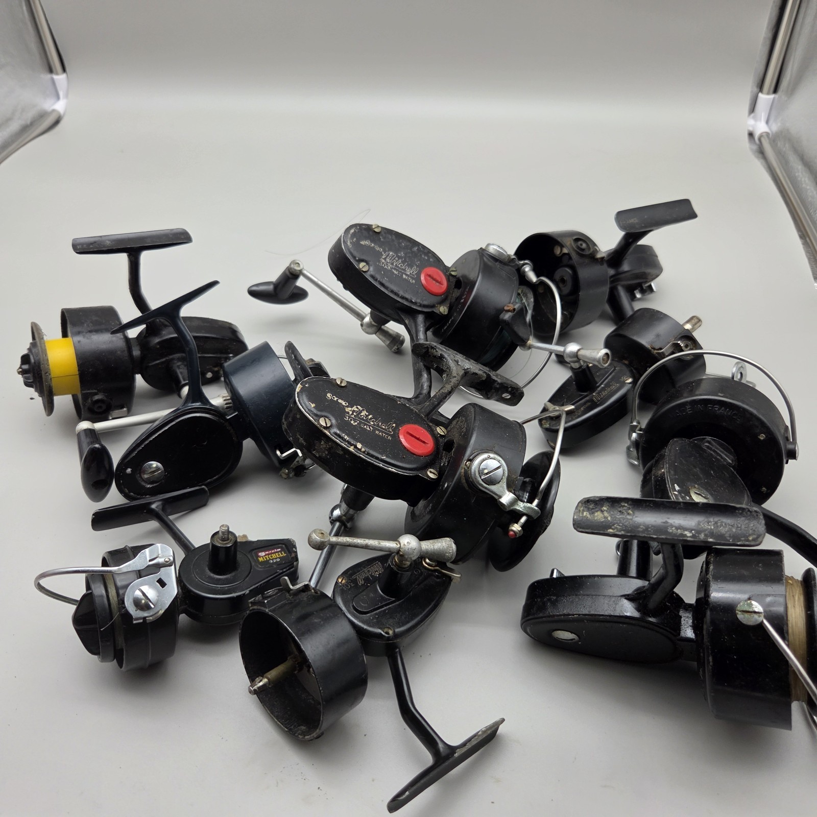 Lot of 11 vintage Mitchell Garcia reels for parts or repair 