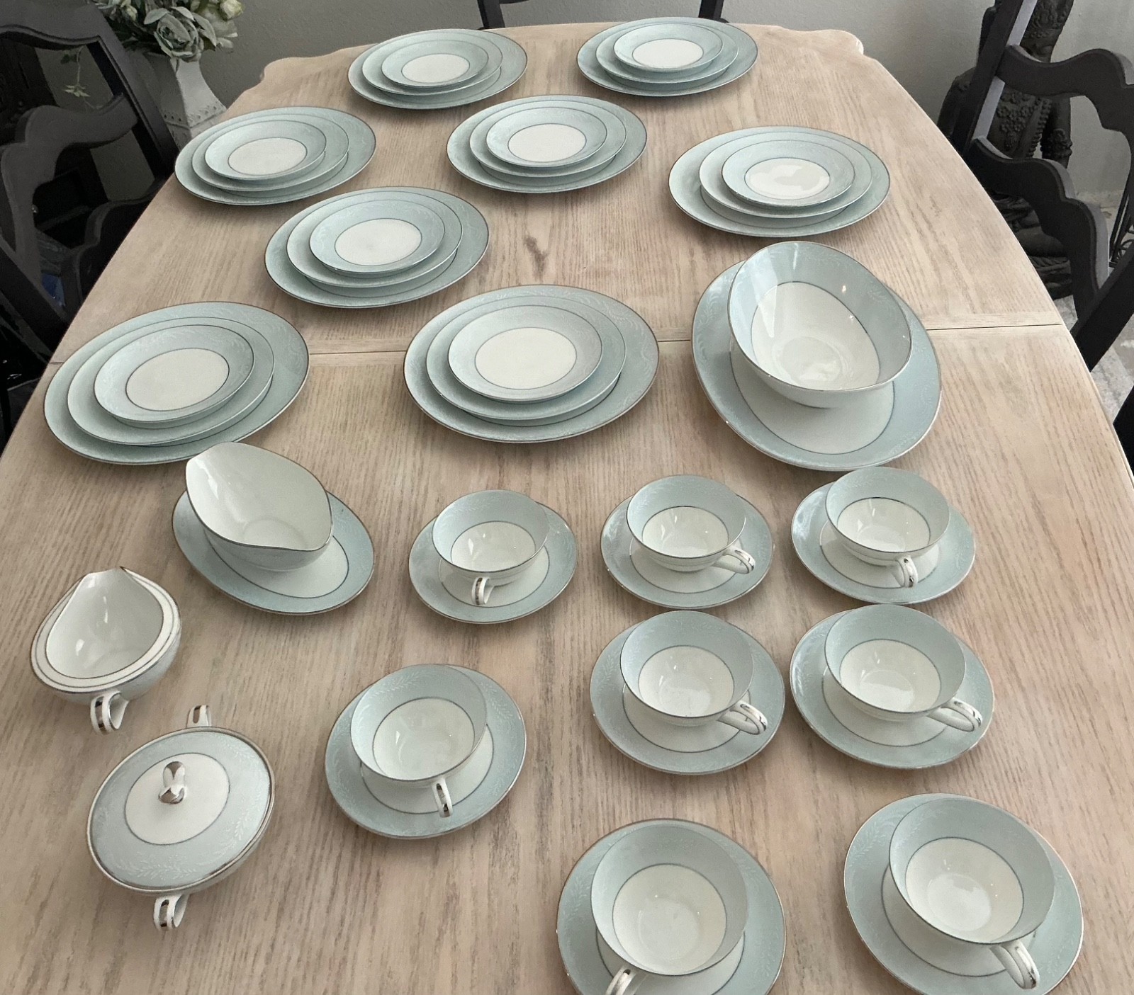 Noritake Laureate dinner set, light blue with beautiful white flower accents Noritake Laureate dinner set, light blue with beautiful white flower accents