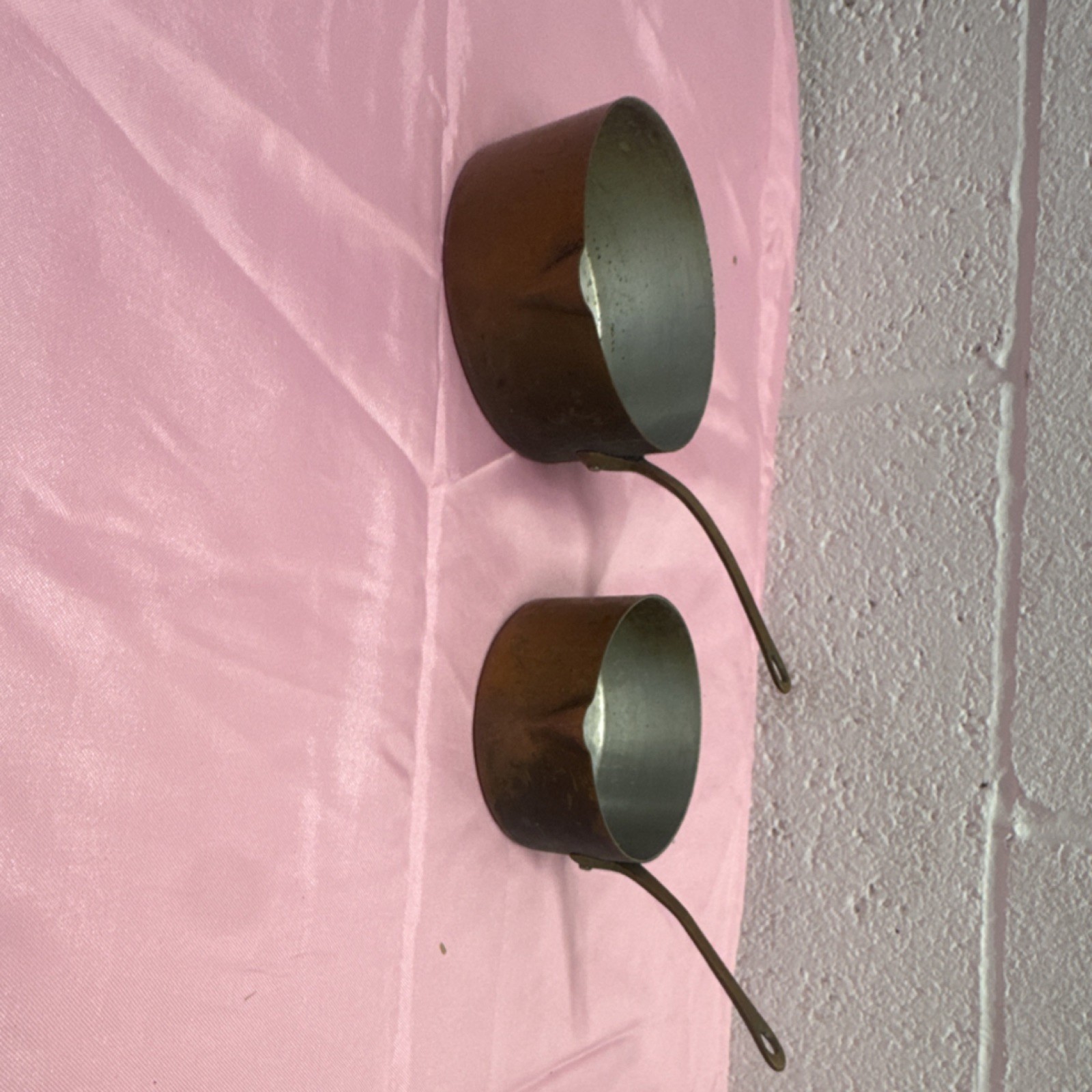 Pair of vintage French copper saucepans with long brass handles. Pair of vintage French copper saucepans with long brass handles.