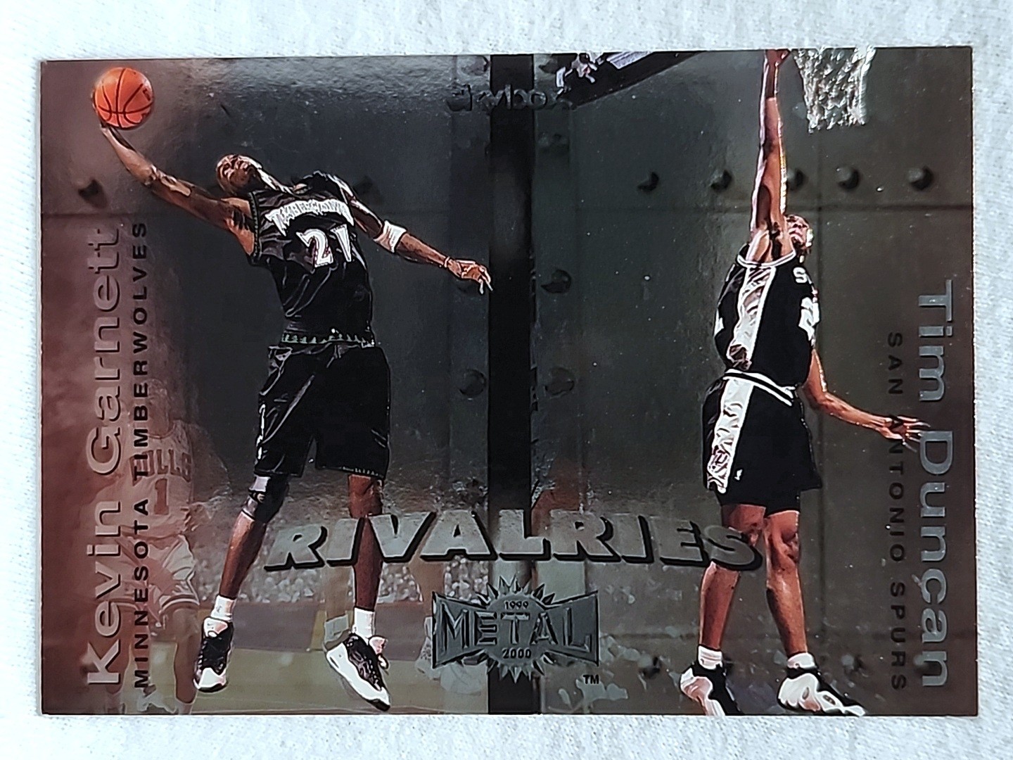 1999-00 Skybox Metal Rivalries Kevin Garnett, Tim Duncan #5R San Antonio Spurs 1999-00 Skybox Metal Rivalries Kevin Garnett, Tim Duncan #5R San Antonio Spurs