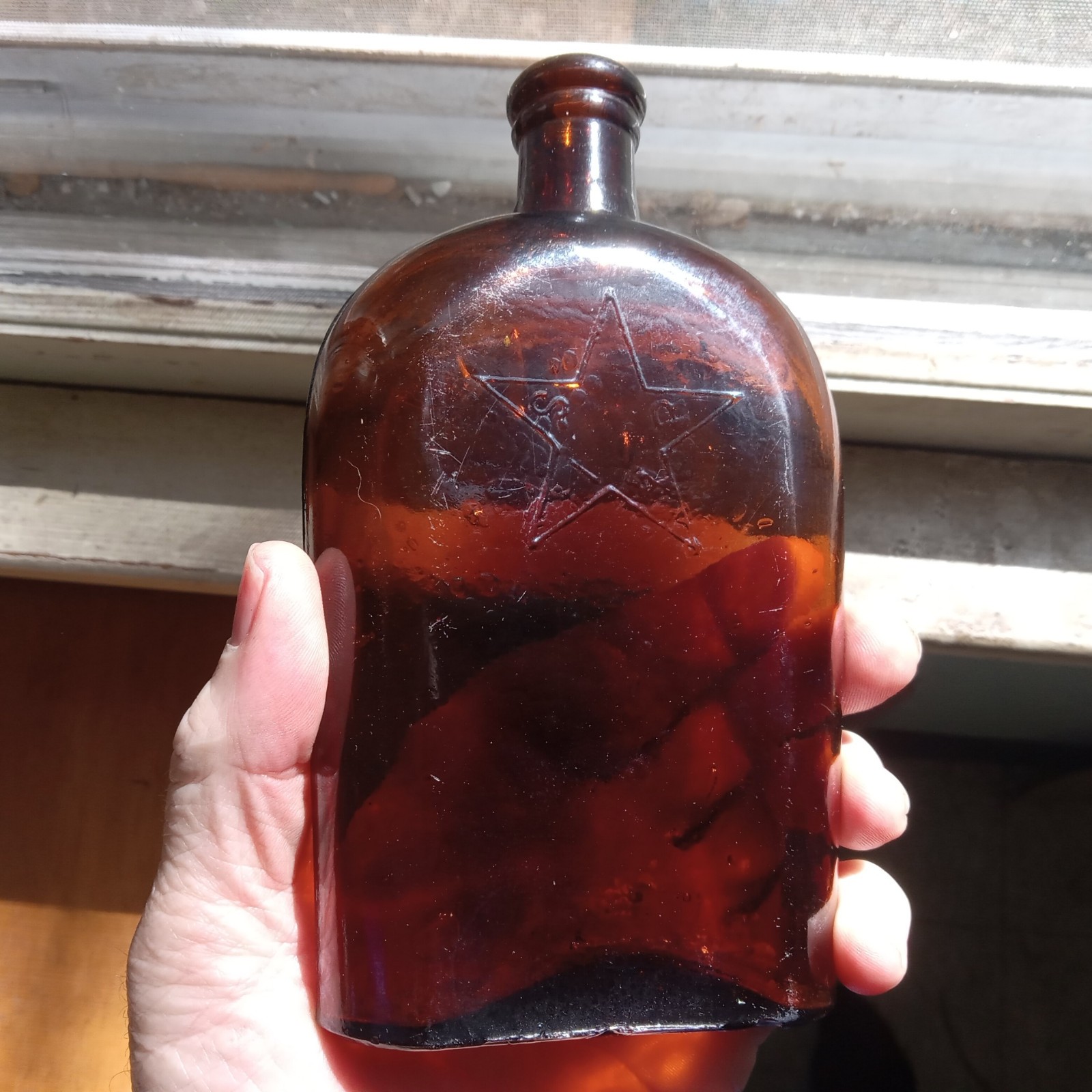 RARE 1870s STAR INSIDE STAR AMBER ODD OVAL SIDE SEAM WHISKEY FLASK STAR GLASS CO