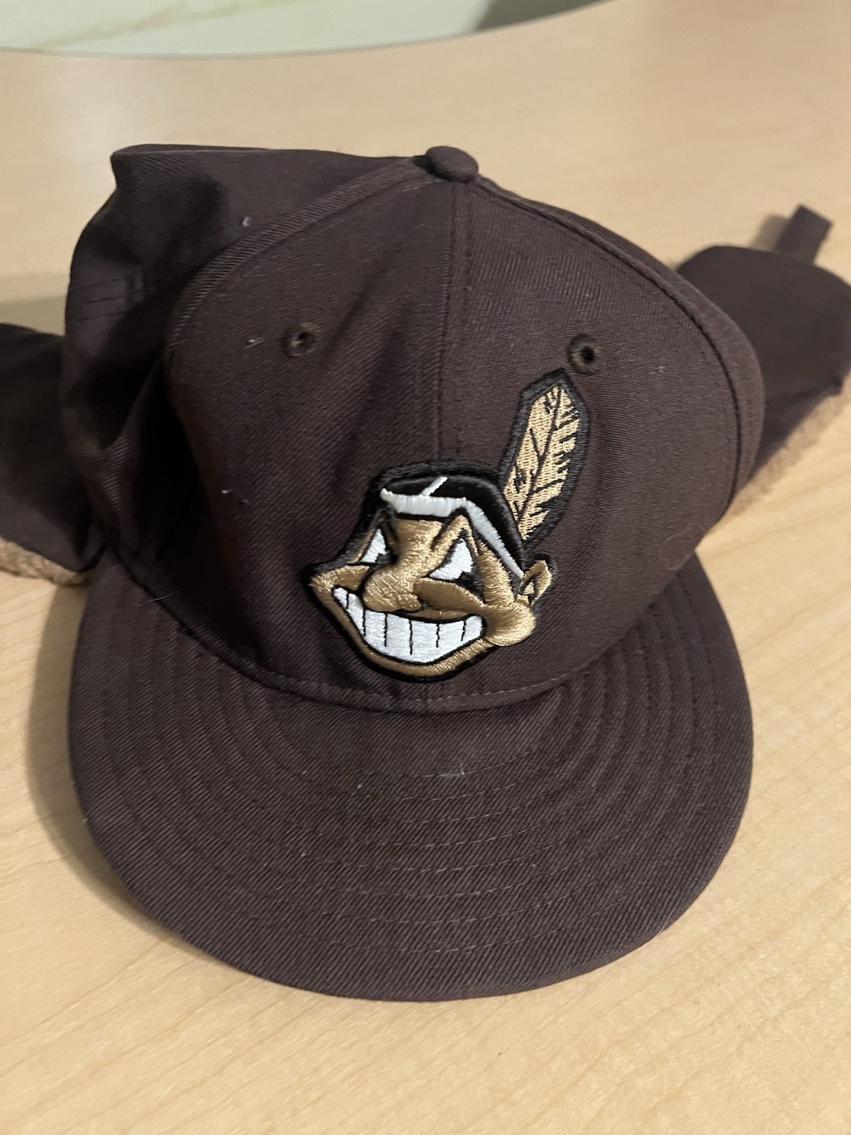 brown winter trapper-style baseball cap featuring the vintage Cleveland Indians brown winter trapper-style baseball cap featuring the vintage Cleveland Indians