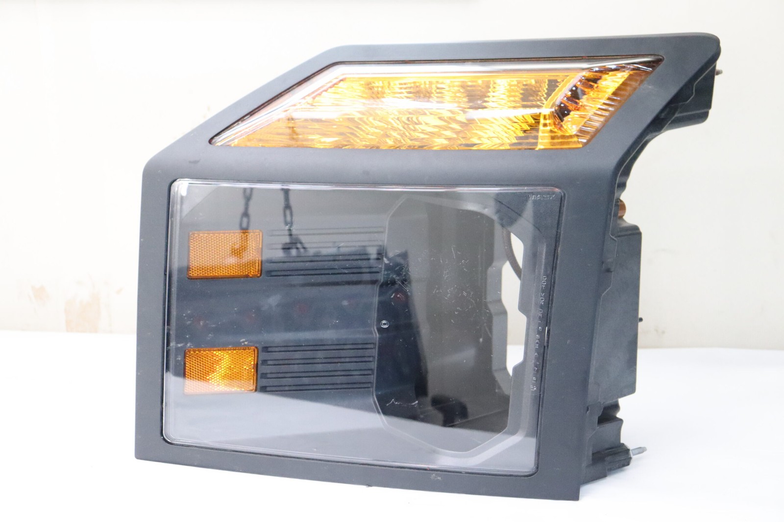 used left side mack headlight lens 23992217 23992216
